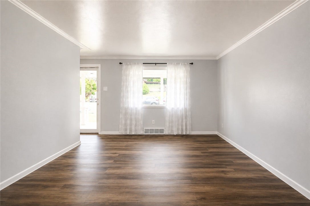 Living room as a blank canvas ready for you to move in!