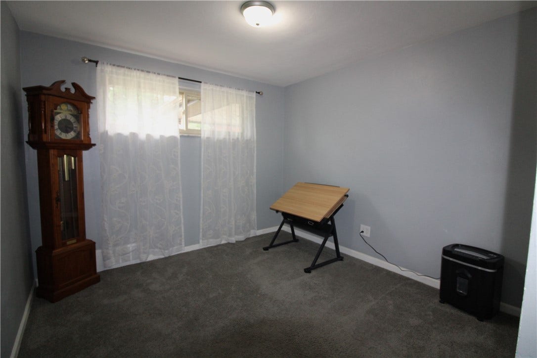 Same third bedroom without staging.  Owners used it as an office/ craft room.