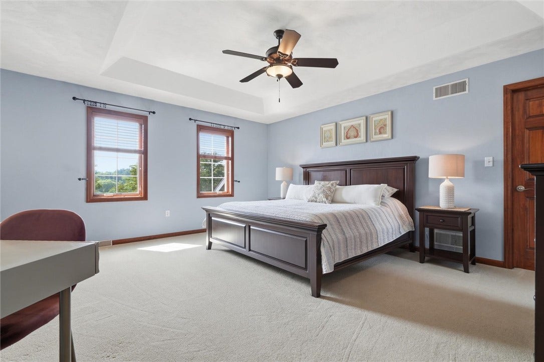 Large 17x17 Primary Suite with Tray Ceiling and 15.5 x 6 Walk in Closet with 11x8 Adjoining Walk in Storage.