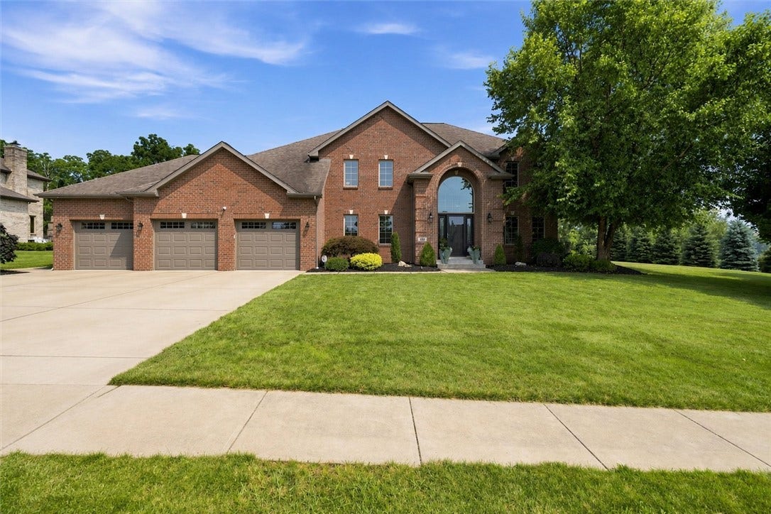This Custom RWS Shuster, Home is 87.5% Brick with Keystone and Coined Brick Detail.