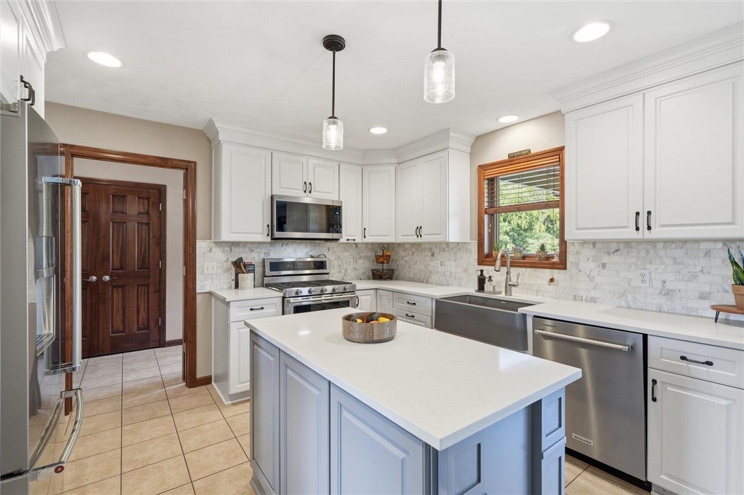 Open to the Laundry / Mudroom Room with Access to the Attached 3 Car Garage and Pool Area.
