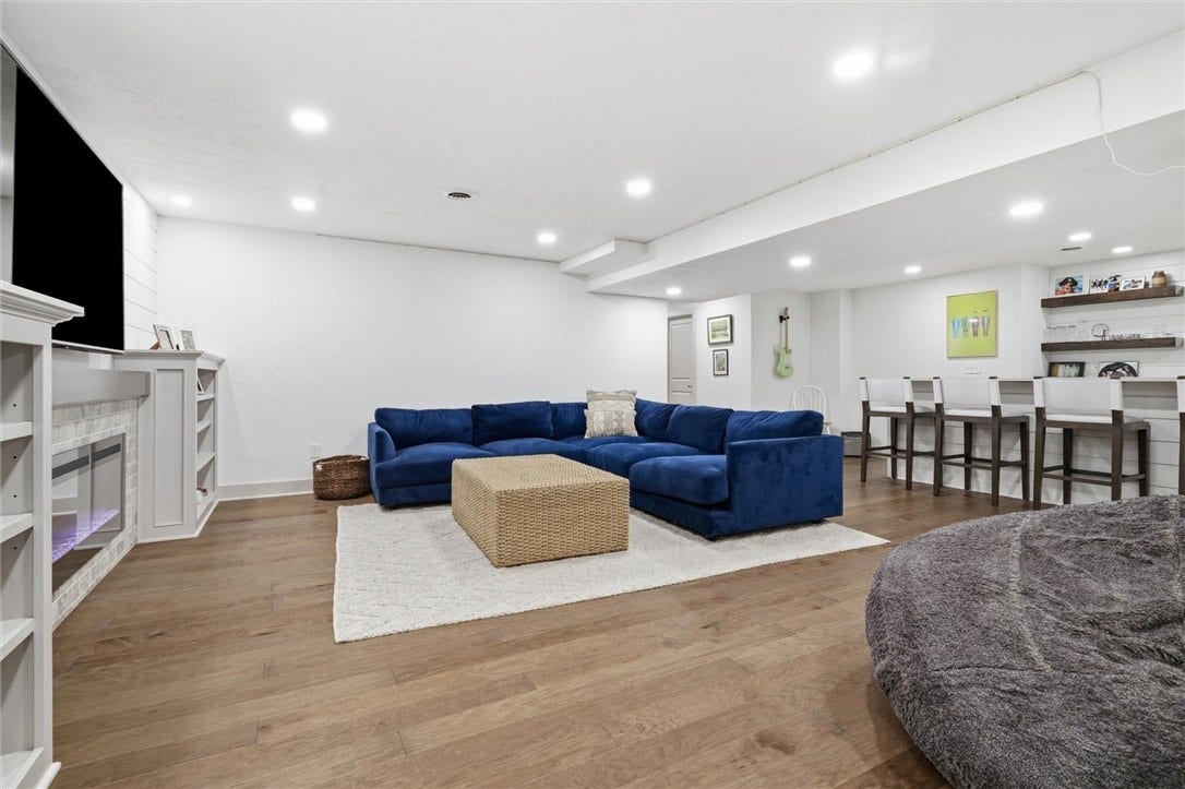 Amazing Finished Basement with Engineered Wood Flooring, Built ins, and Recessed Lighting.