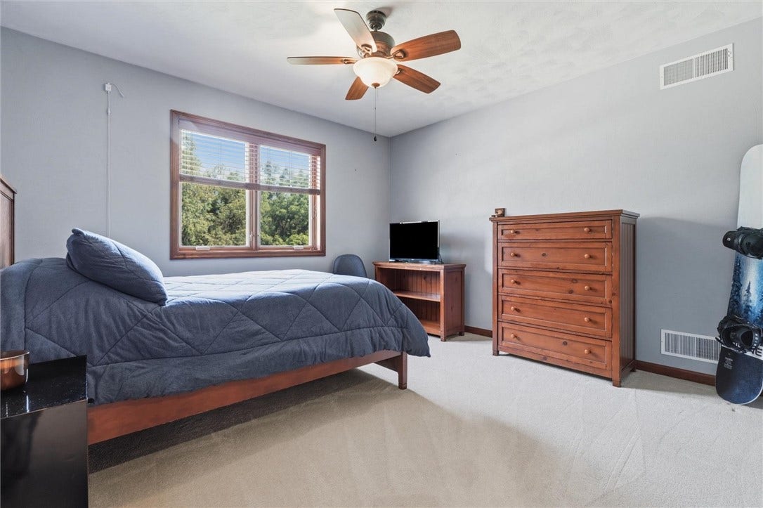 12x12 Bedroom #3, Rear Facing with Lighted Walk in Closet.