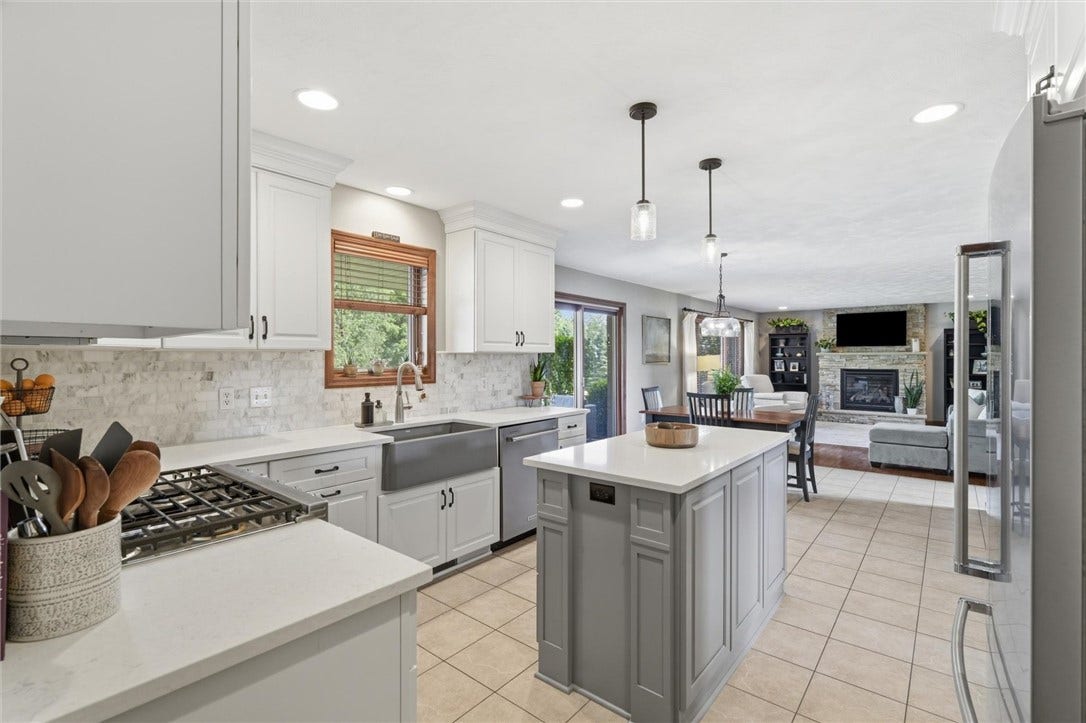 Quartz Topped Island and Counters and Soft Close, Full Extension Drawers and Doors in the Kitchen.
