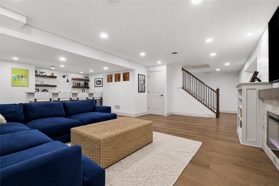 HUGE Finished Basement with Bar, Home Gym Area, 1/2 Bath, and Tons of Storage.