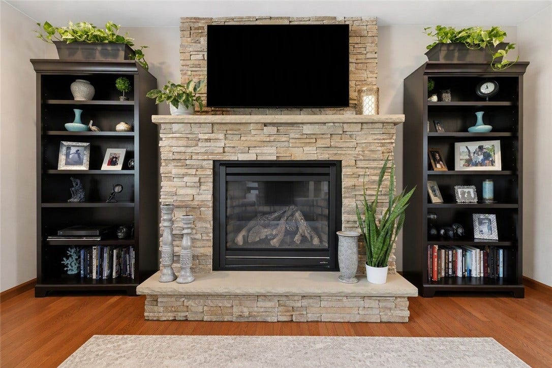 Beautiful Stacked Stone Gas Fireplace Warms the Family Room.