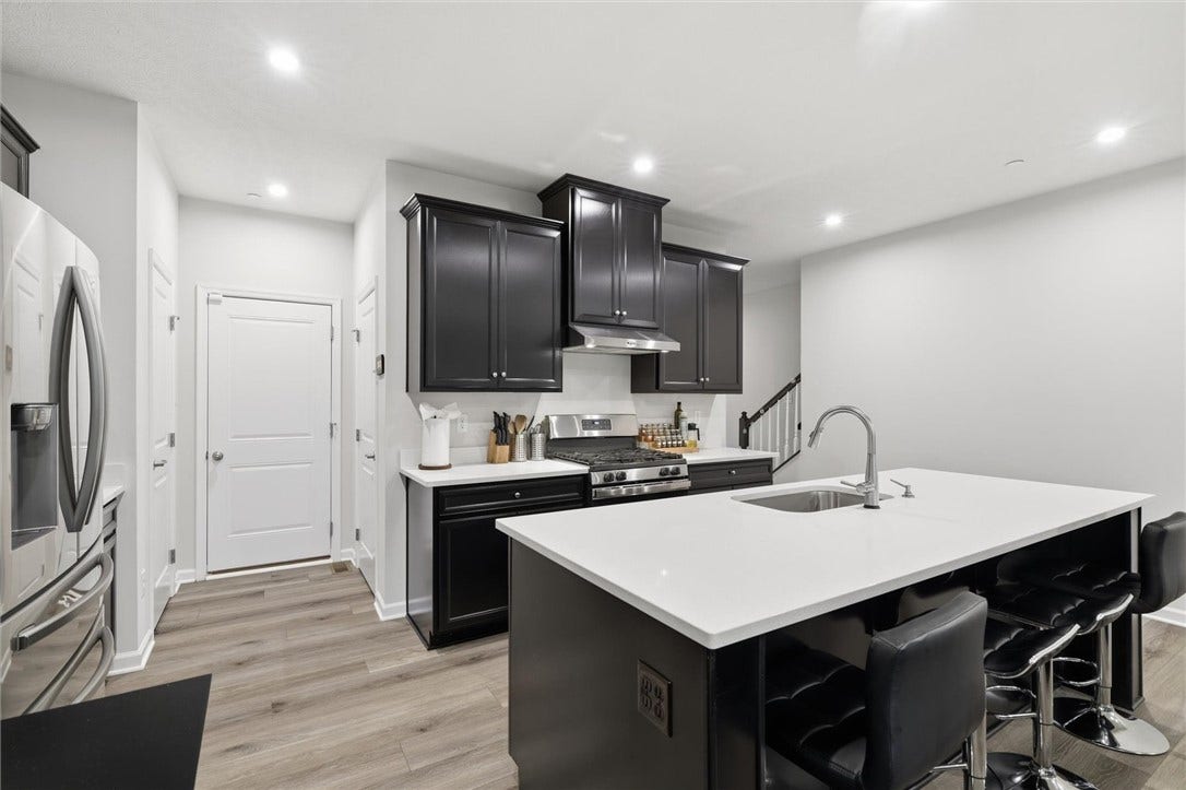 Level entry access from Attached, 2 car Garage, Lighted Pantry and hall closet.  Garage measures 19'x18'.
