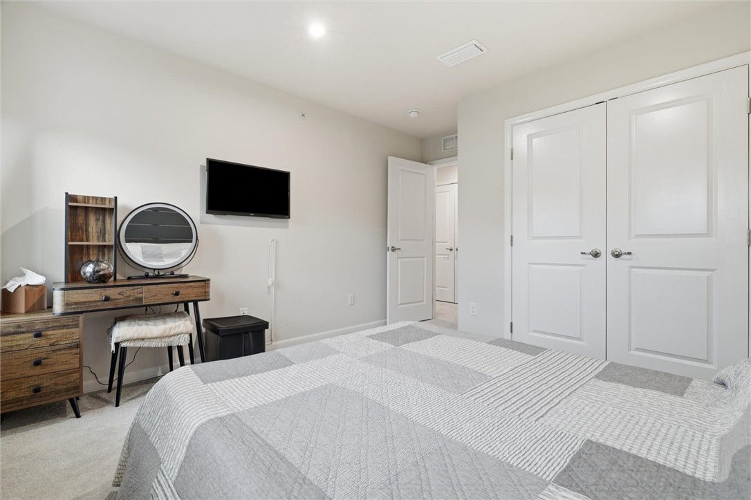 Enjoy abundant storage with a full wall of closet space, plus a hallway closet with double doors for linens and extra household items.