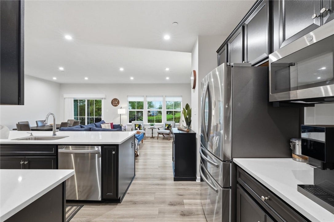 Other SS appliances include a GE Dishwasher tucked away in the Island and microwave oven.