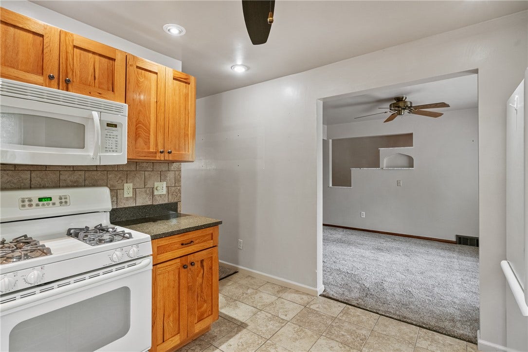 and granite countertops as well as a built in pantry