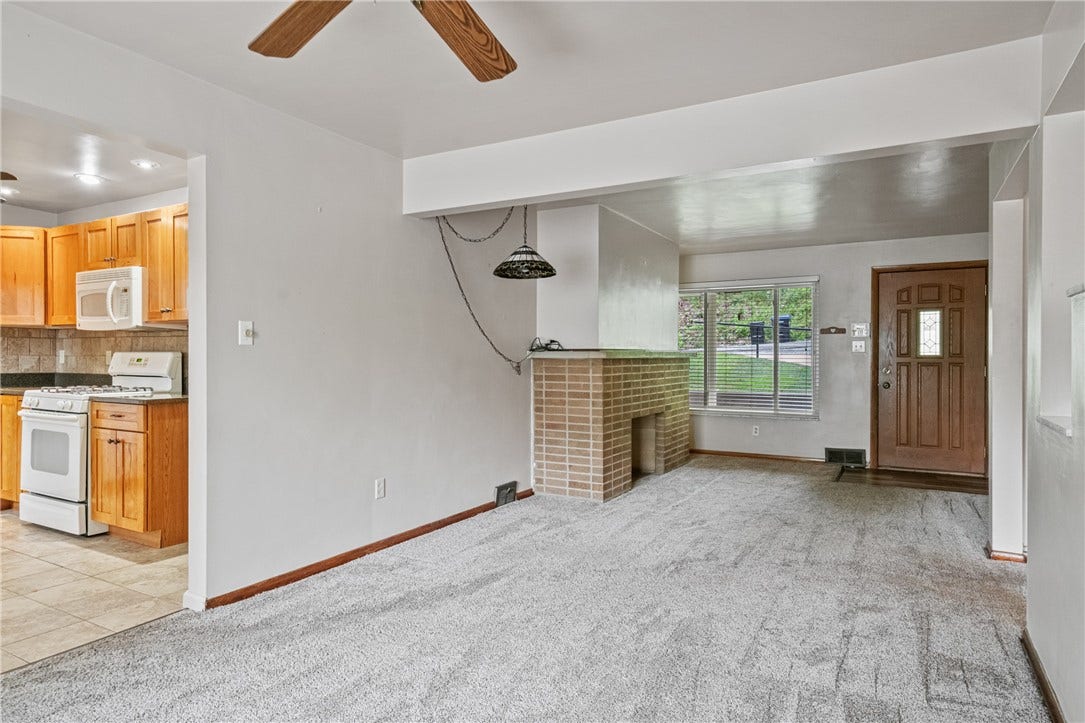 The kitchen is to the right of the dining area when you step inside the home