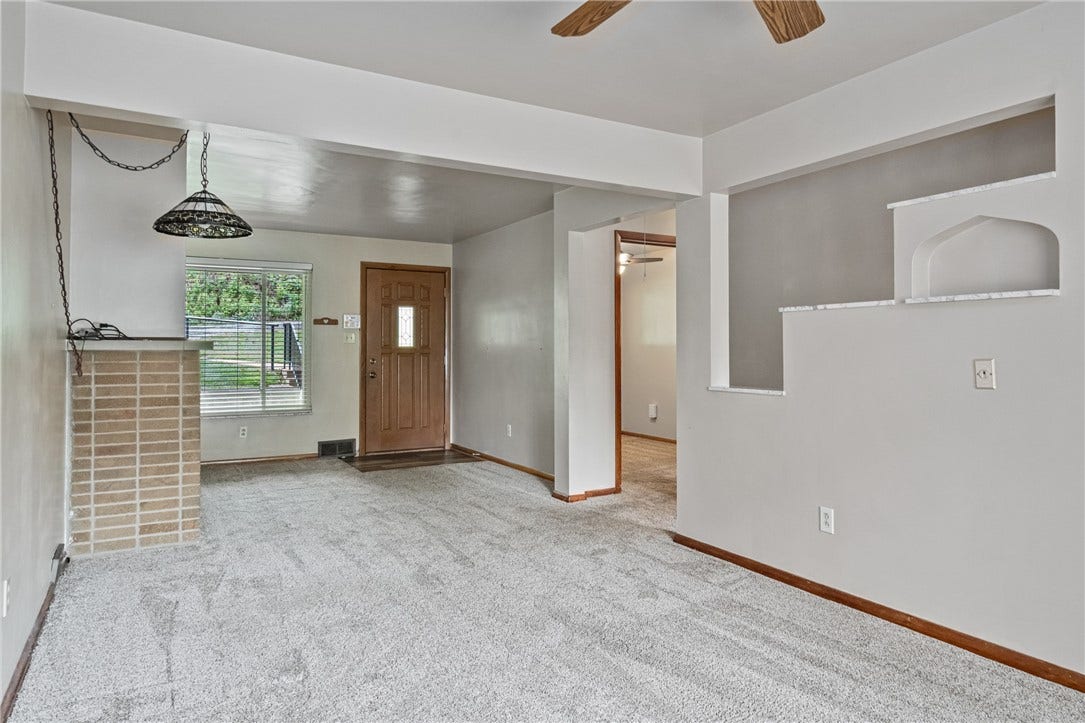 Looking back at the front door into the hallway (3rd bedroom on the left)