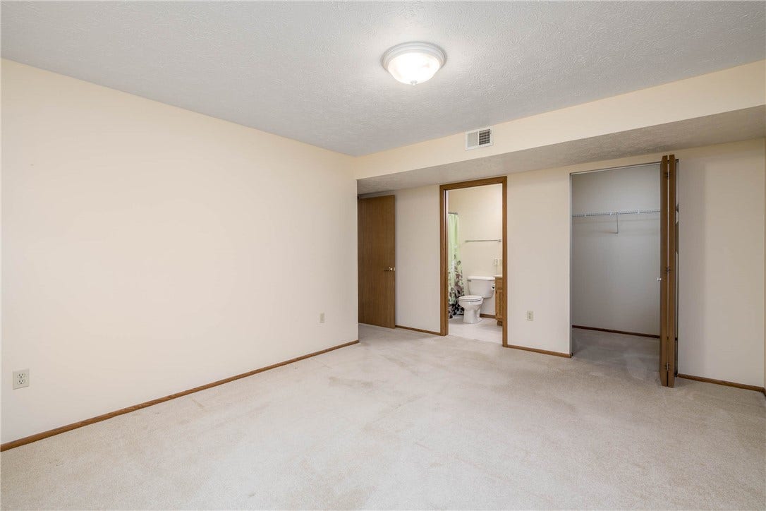 View to walk in closet and full bath.