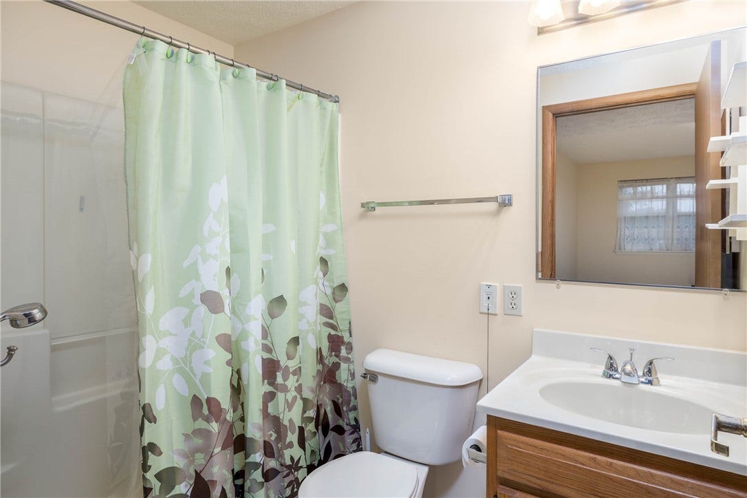 Full bath located in primary bedroom.
