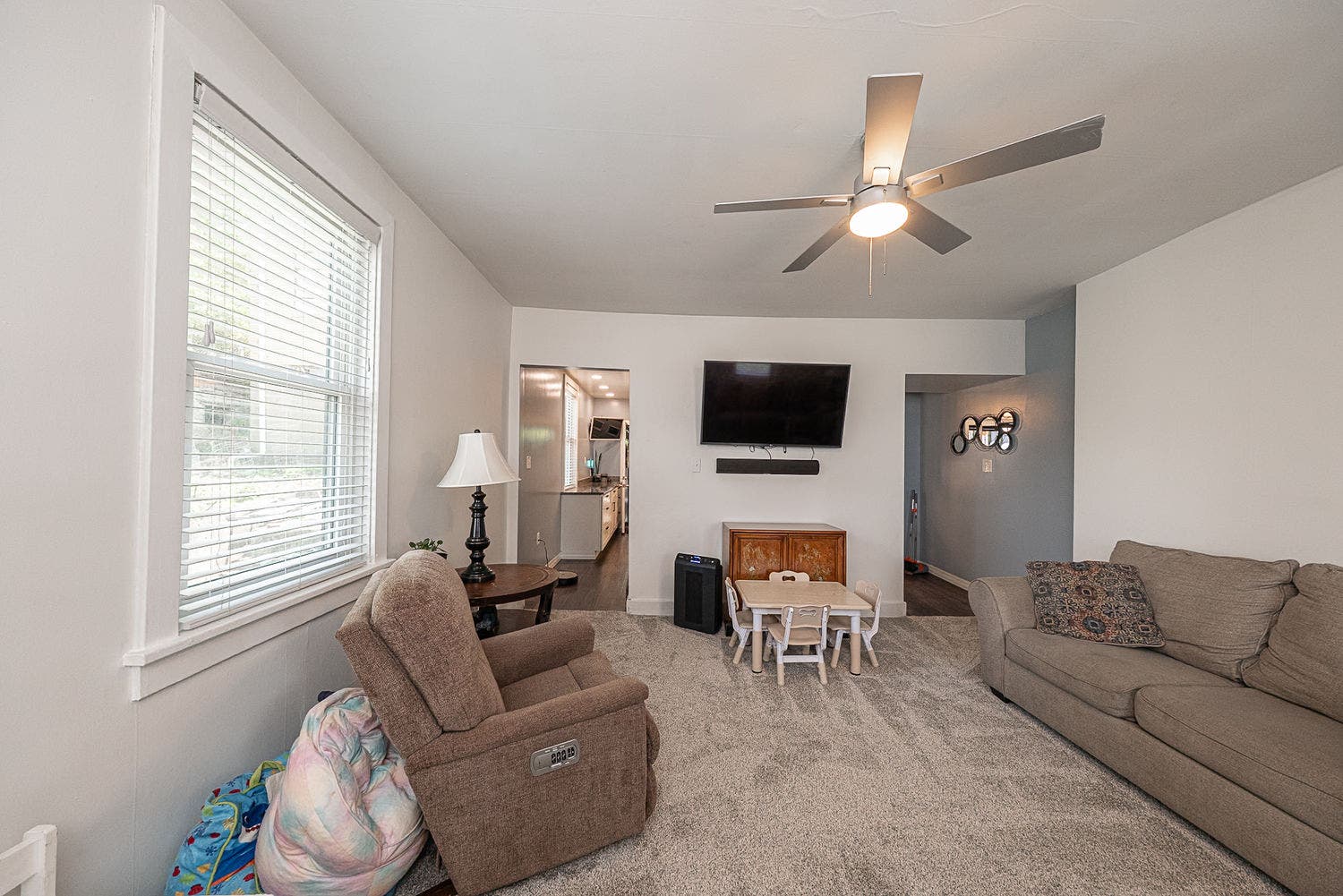 952 Herron Avenue, Pittsburgh, PA 15219 Ceiling fan with light adds overhead light to the already bright living room.