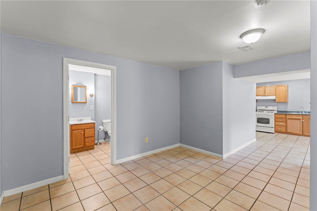 Picture depicts the lower level full bathroom and kitchen.