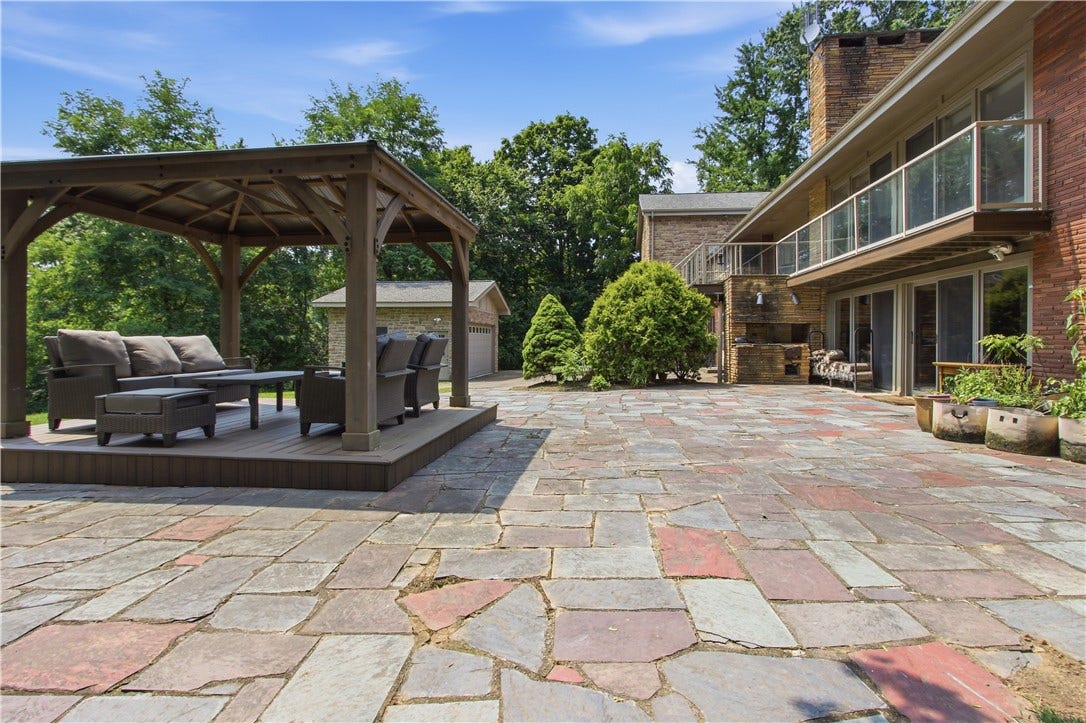 2072 Outlook Drive, Pittsburgh, PA 15241 A spacious stone patio creates the perfect backdrop for summer gatherings.