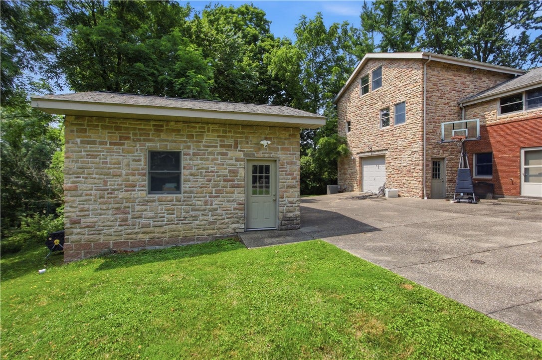 2072 Outlook Drive, Pittsburgh, PA 15241 A detached outbuilding provides exceptional versatility with two additional garage spaces, abundant storage, and endless possibilities for hobbies or a workshop.