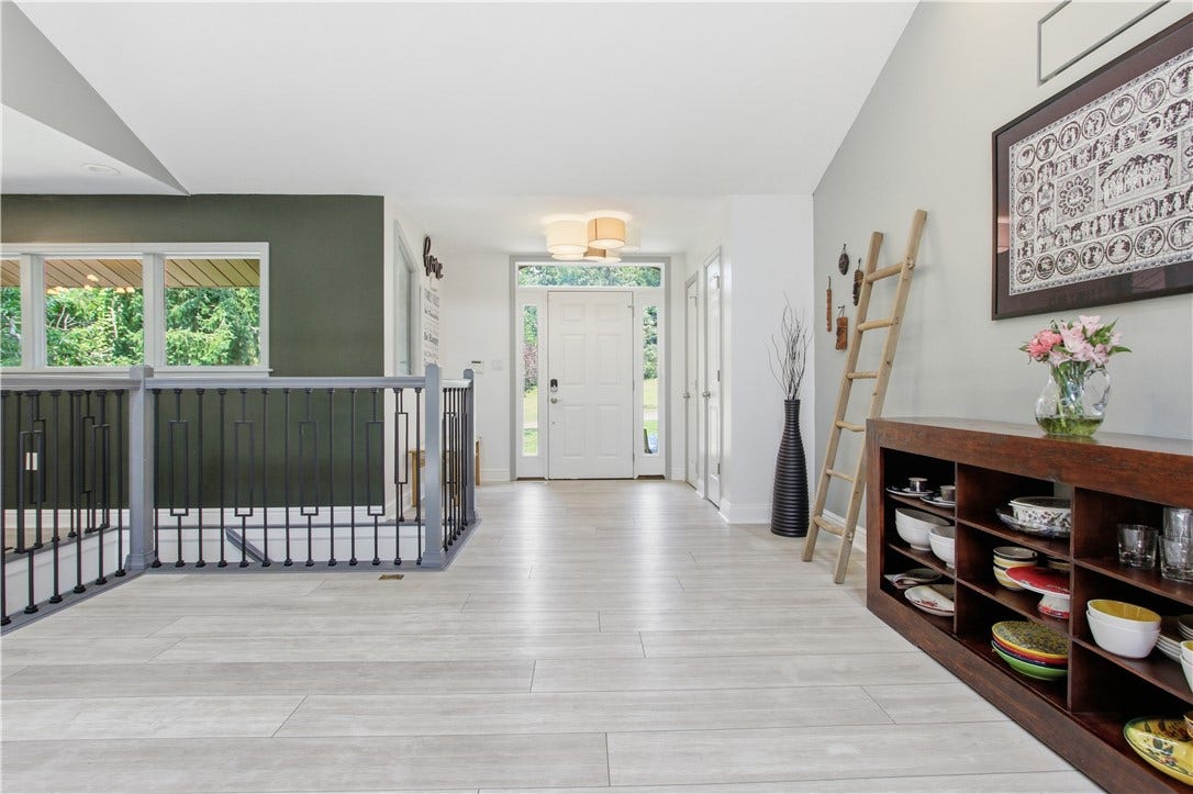 2072 Outlook Drive, Pittsburgh, PA 15241 The spacious entry seamlessly connects the home's main living spaces, creating an inviting atmosphere for everyday living and entertaining.