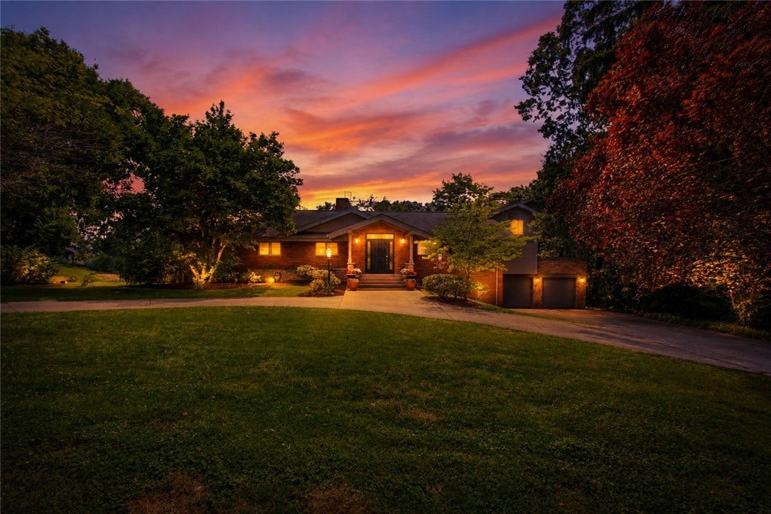 2072 Outlook Drive, Pittsburgh, PA 15241 Twilight photography captures the warmth and elegance of this remarkable residence.