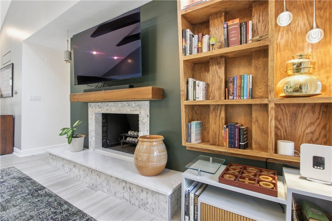 2072 Outlook Drive, Pittsburgh, PA 15241 A custom fireplace with built-in shelving serves as the stunning centerpiece of this warm and inviting living space.