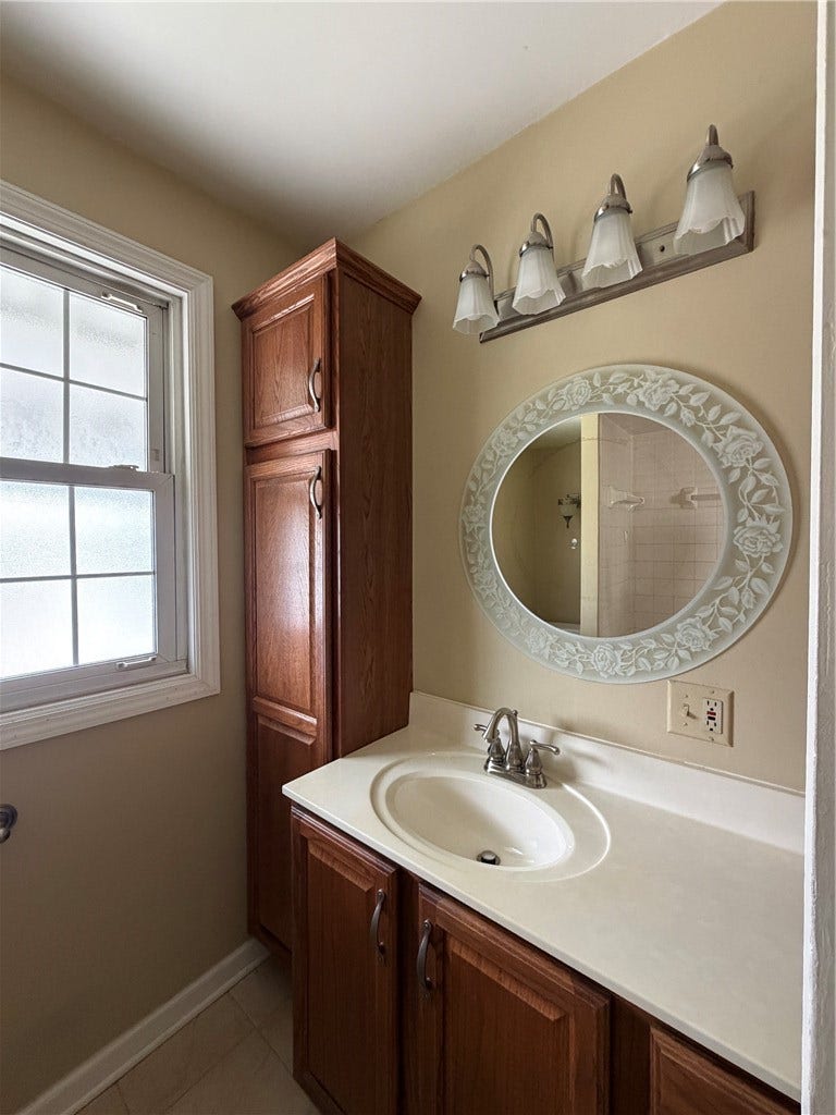 169 Allegheny Ave, Pittsburgh, PA 15202 Hall Bath with ceramic floor, tub/shower, large vanity and 2 linen cabinets
