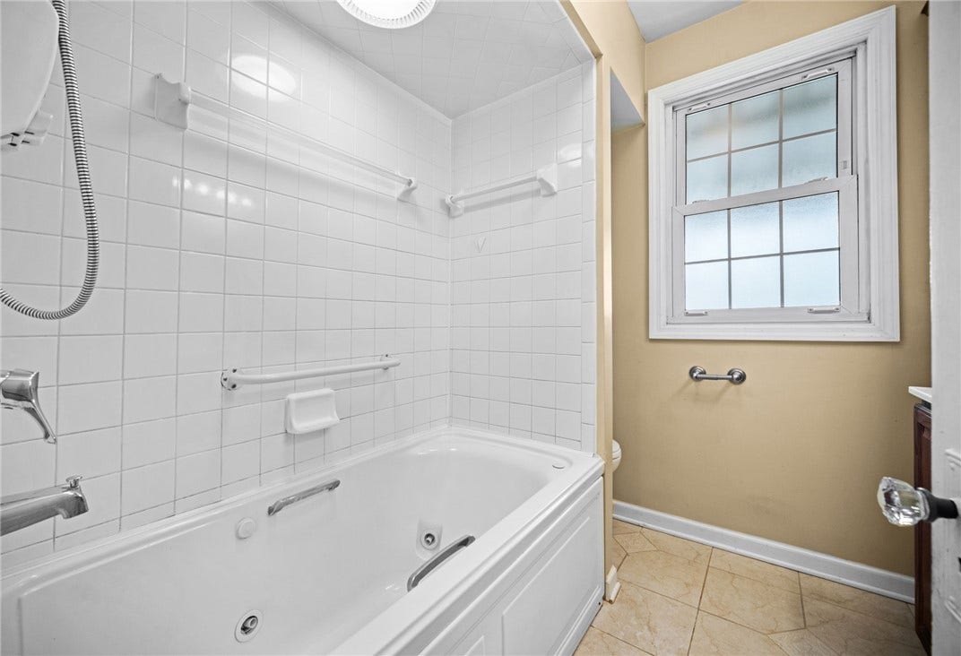 169 Allegheny Ave, Pittsburgh, PA 15202 Hall Bath with ceramic floor, tub/shower, large vanity and 2 linen cabinets