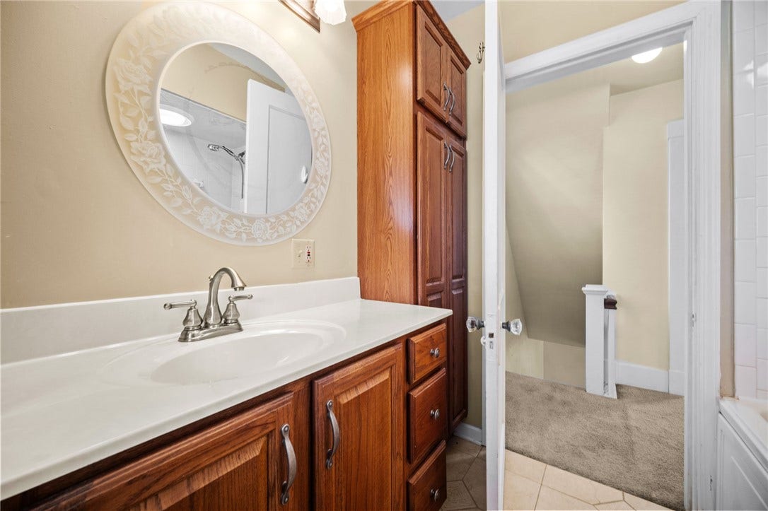 169 Allegheny Ave, Pittsburgh, PA 15202 Hall Bath with ceramic floor, tub/shower, large vanity and 2 linen cabinets