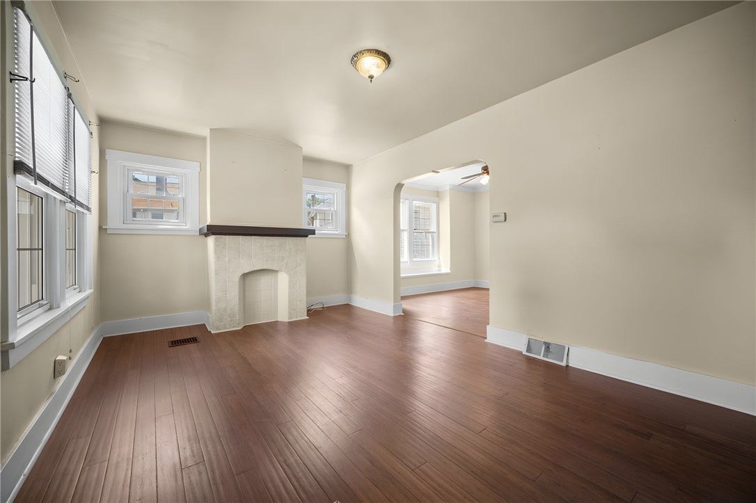169 Allegheny Ave, Pittsburgh, PA 15202 Living Room with Bamboo hardwood floor and decorative fire place. Living Room adjacent to Dining Room.