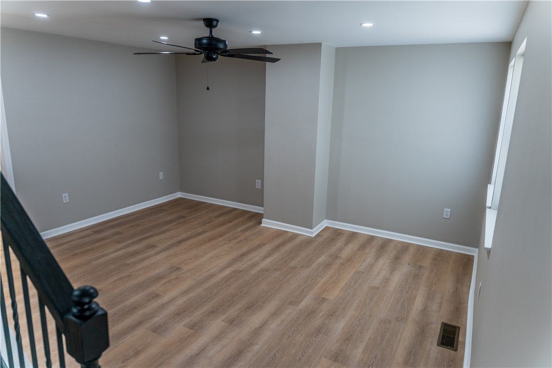 Newly renovated living room with can lighting