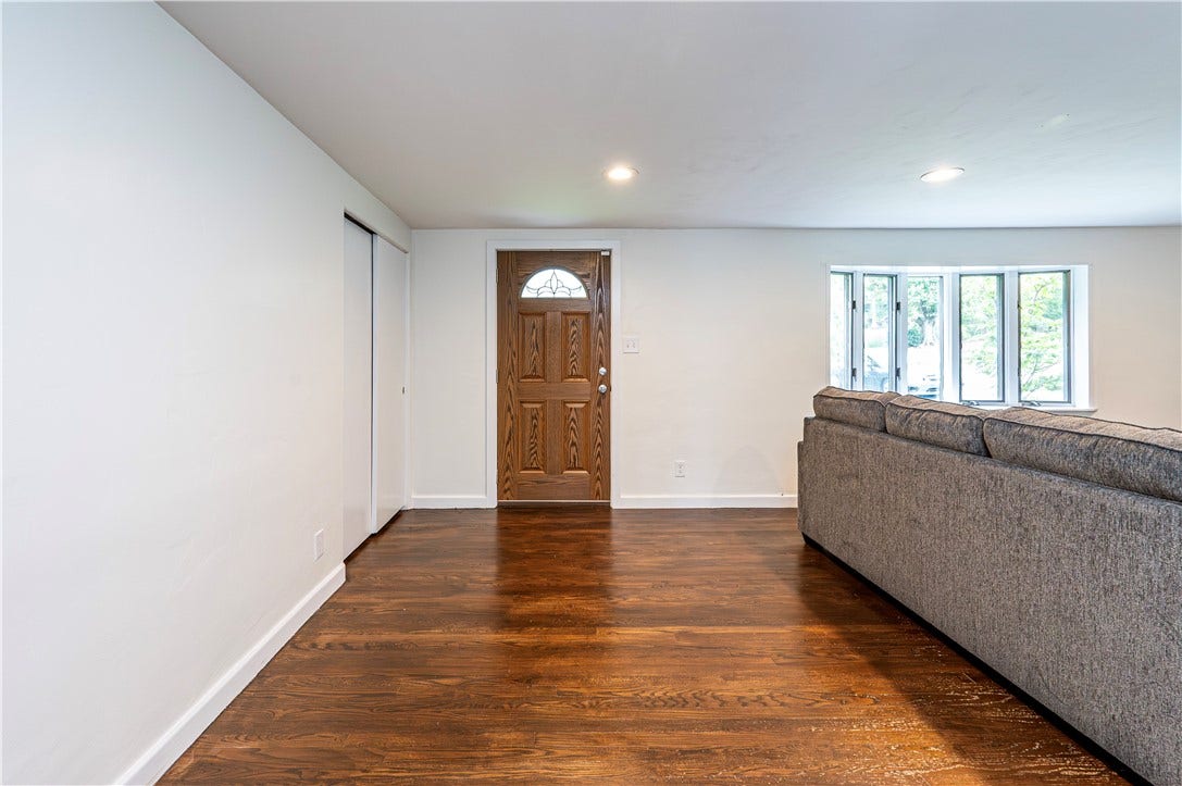 A nice spacious entry way with a closet.
