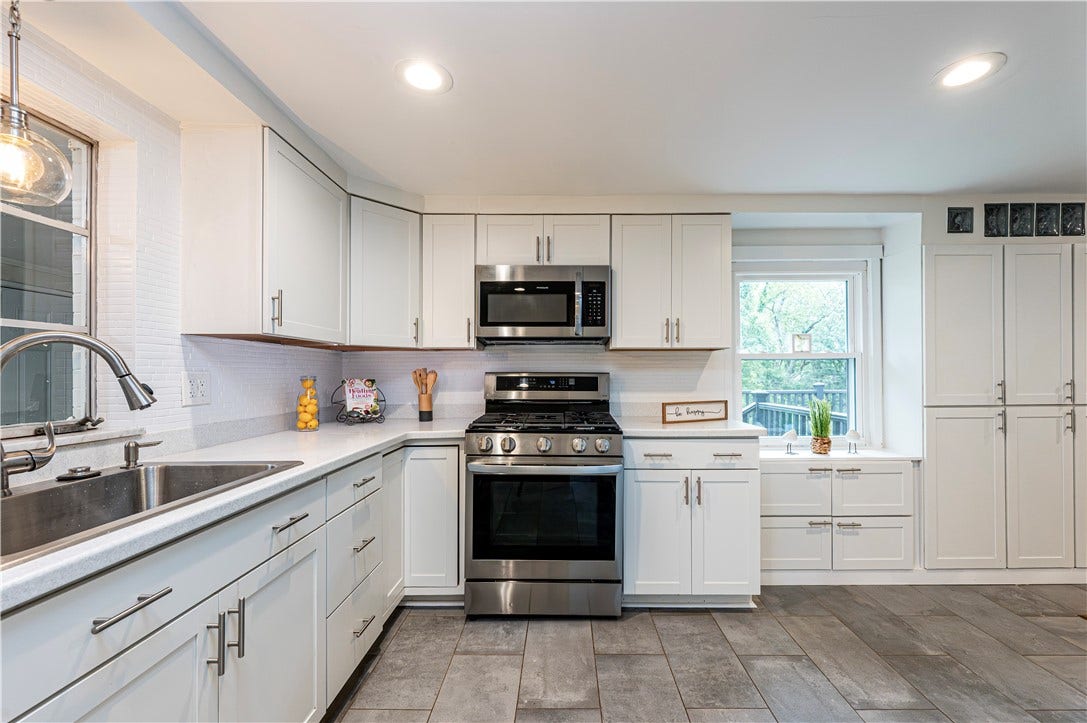 Lots of counter tops for your prepping needs. An oversized sink with sprayer faucet is great for clean up!