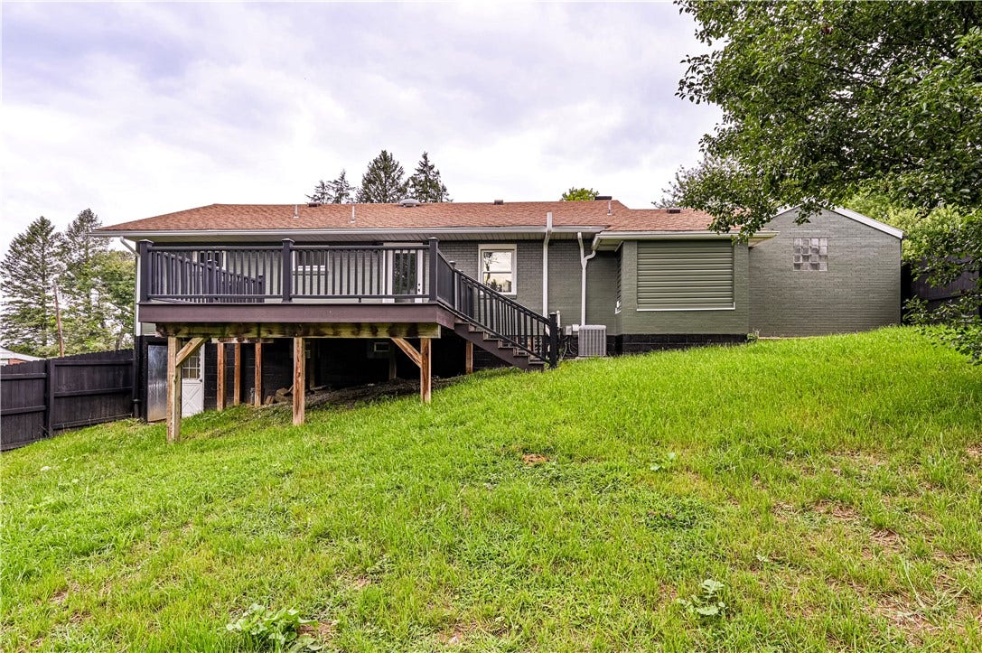A view of part of the fenced in back yard.