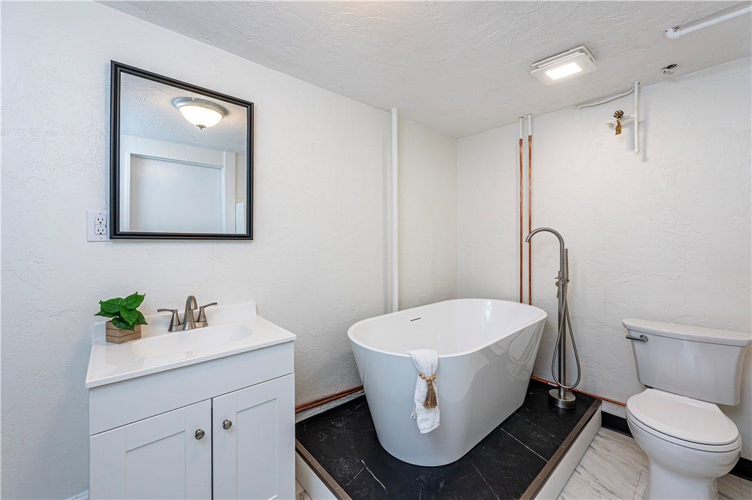 Soak the cares of the day away in this new tub and bathroom.