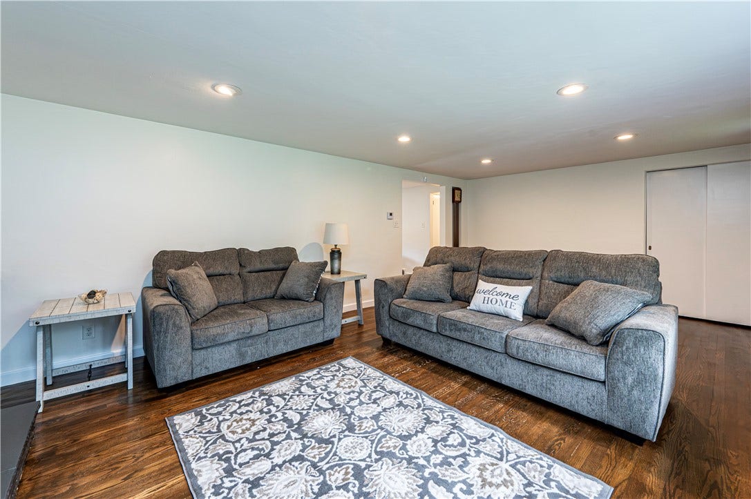 Love the gleaming hardwood floors and nd recessed lighting.