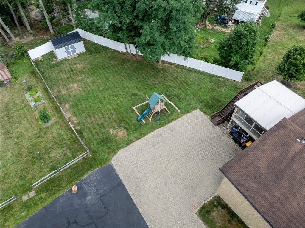Aerial view of the functional backyard and shed.