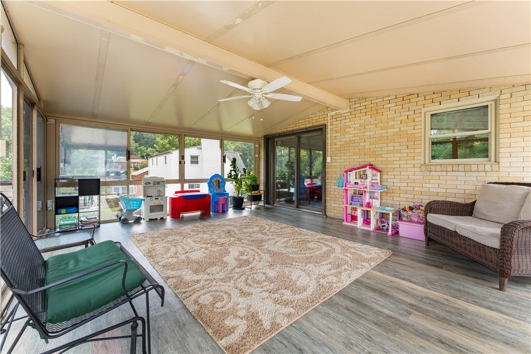 Relax and enjoy the beautiful weather from the comfort of this sun-filled space, perfect for watching a passing rain storm or basking in the afternoon light.