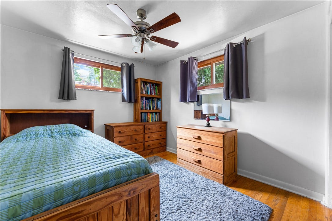 The third floor is also appointed with hardwood floors and a ceiling fan.