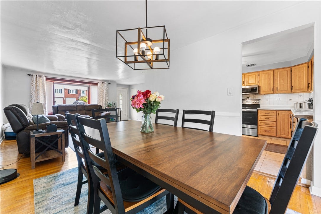 Spacious formal dining room with comfortable seating for six, perfect for hosting dinner parties or holiday gatherings.