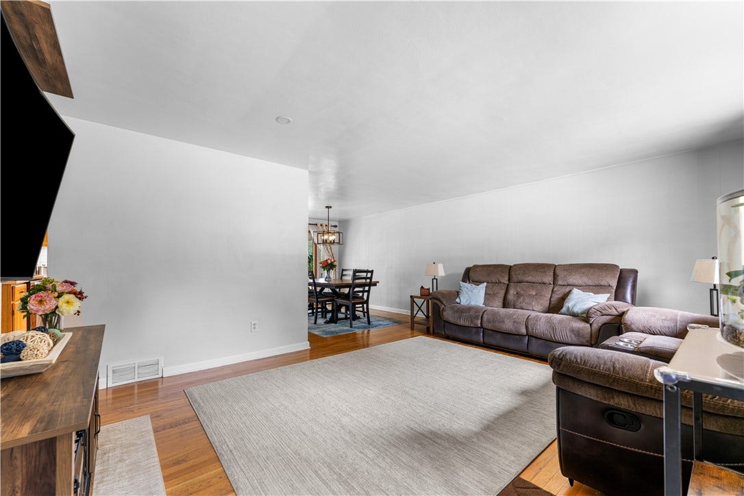 Open floor plan highlighting the living room and formal dining area.