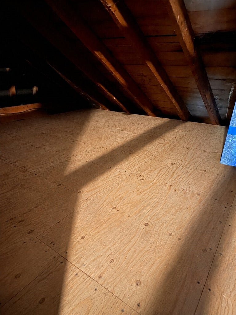 2661 Old Washington Road, Pittsburgh, PA 15241 AI photo showing the attic above kitchen ceiling with deck boards for storage.