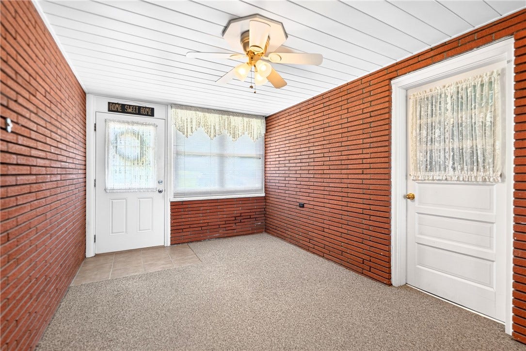SUNROOM CONNECTS TO ATTACHED GARAGE~