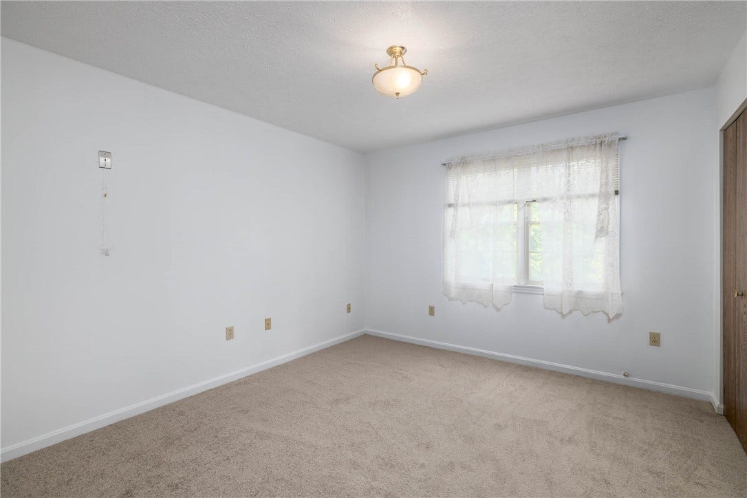 Freshly painted bedroom with new carpet.