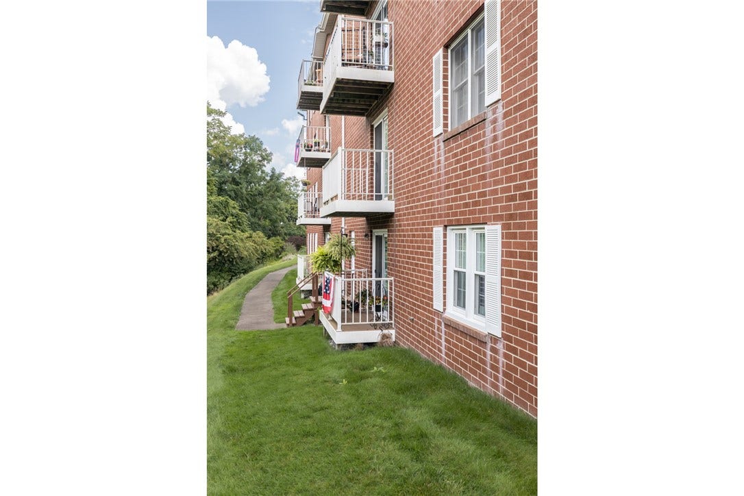 Back of condo with view to small deck.