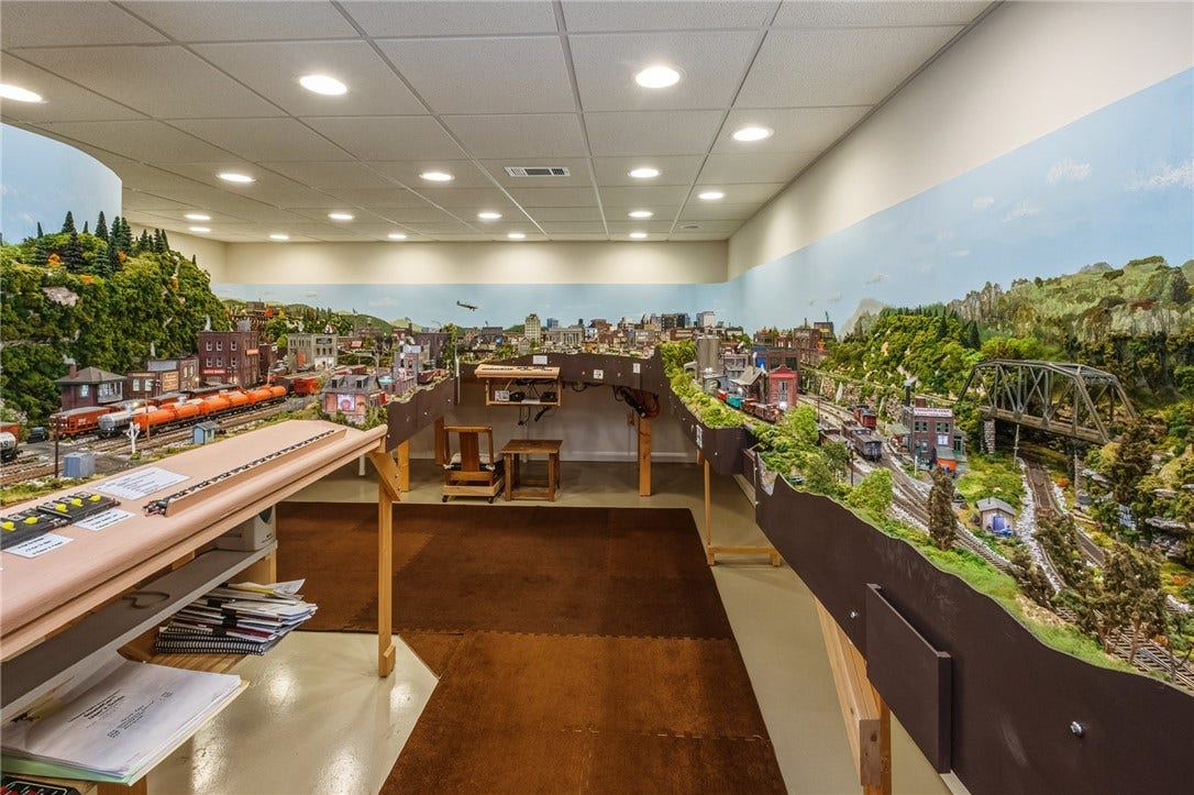 In another of the finished spaces in the huge basement, you'll find this magical, fully functional, HO scale model train set which can provide hours of fun.