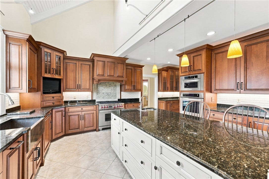 In addition to your large, farmhouse style sink, you'll find a prep sink near the stove on the island.