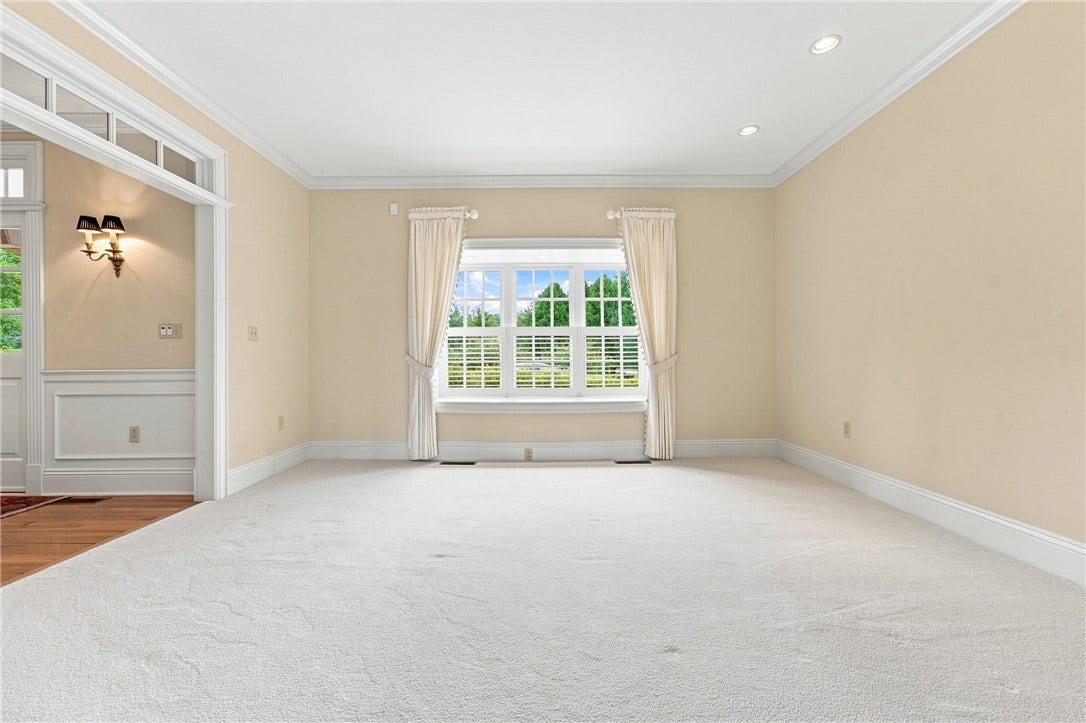 This secondary living space is perfect for a formal living room, a music room, or any number of use options.