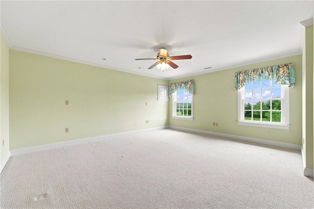 This generously sized bedroom upstairs has potential to be a second "primary" bedroom with an ensuite bathroom and a large walk-in closet