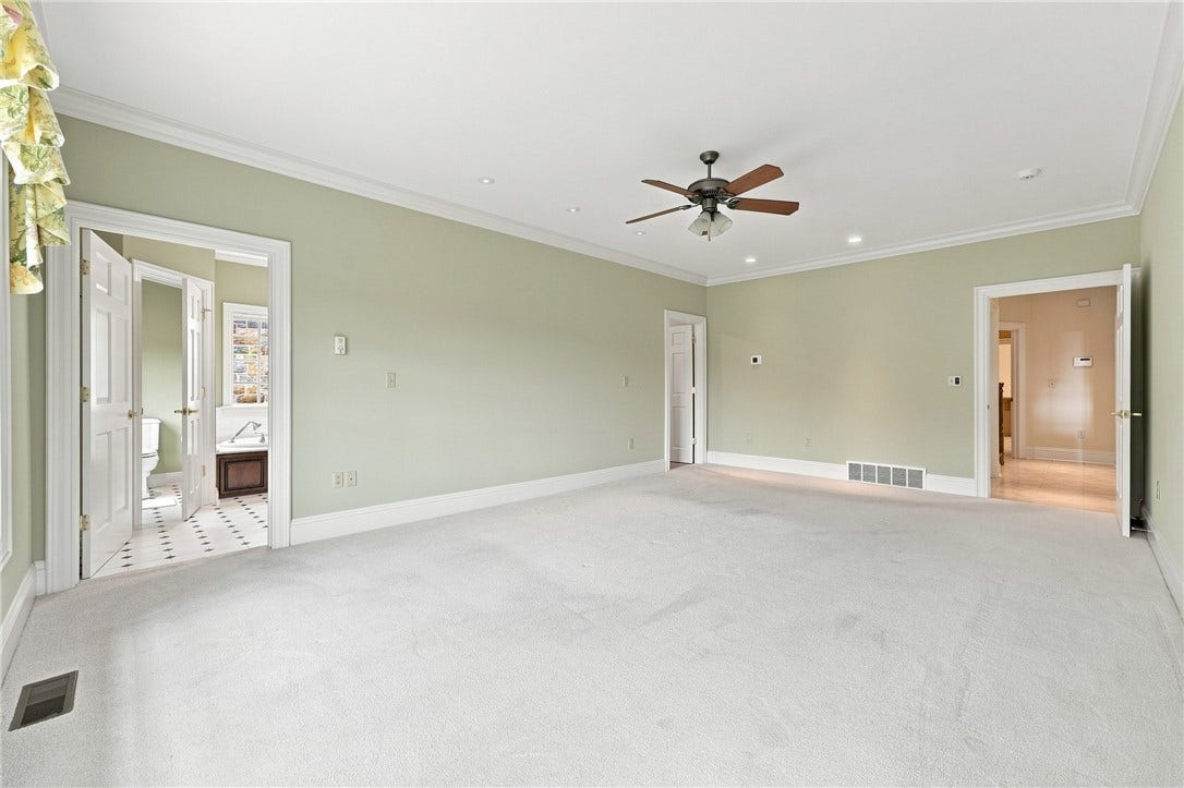 The spaciousness of the primary bedroom offer so many options for furniture placement.