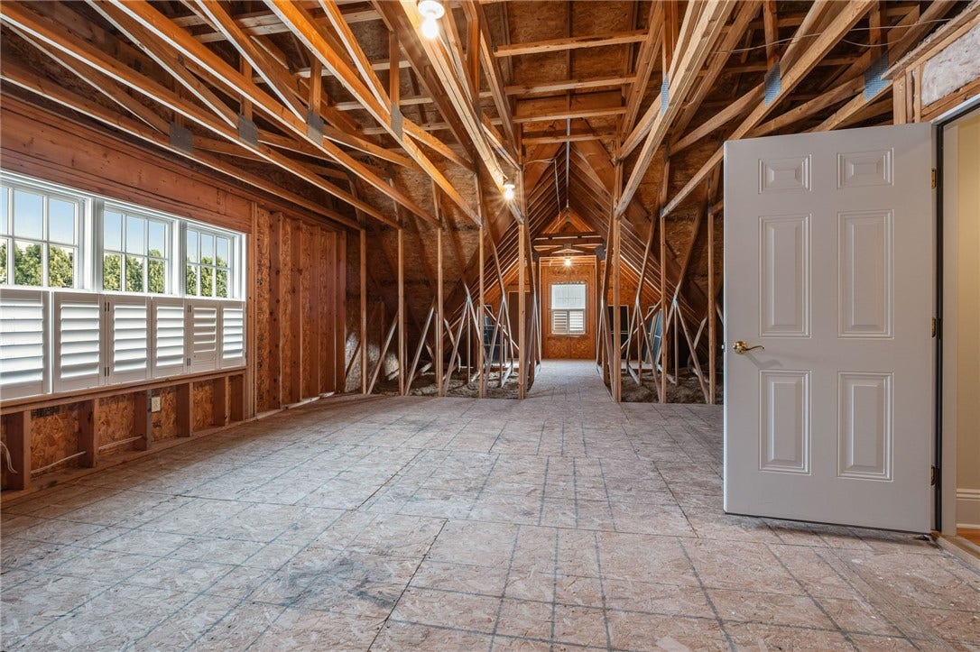 The unfinished attic space is ready for storage or to be finished into a space that meets your specific requirements.